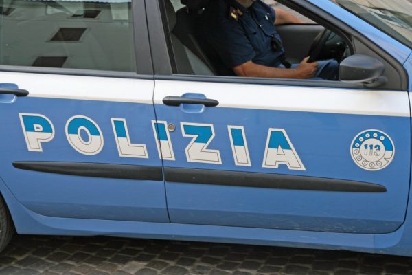 blue Italian police car with written Polizia